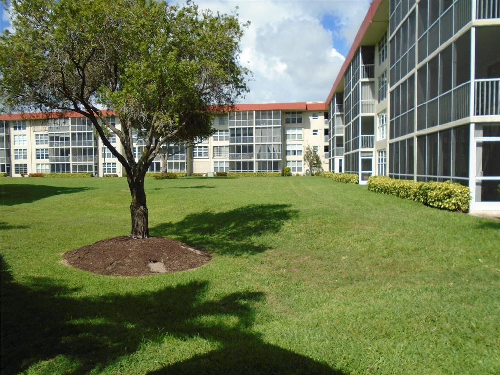 3165 Northeast 48th Court, Unit 110 Lighthouse Point, FL 33064 - Photo 40 of 49 a view of outdoor space yard and green space