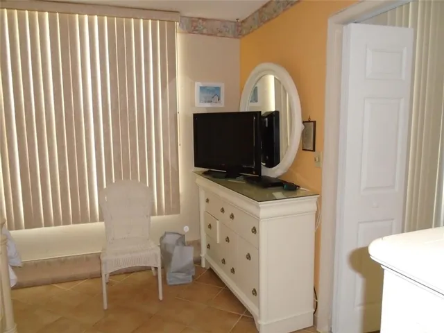 a room with furniture and flat screen tv