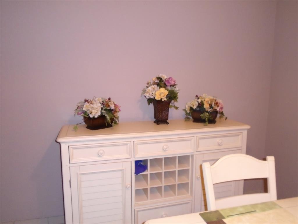 3165 Northeast 48th Court, Unit 110 Lighthouse Point, FL 33064 - Photo 5 of 49 a kitchen with a sink cabinets and a potted plant