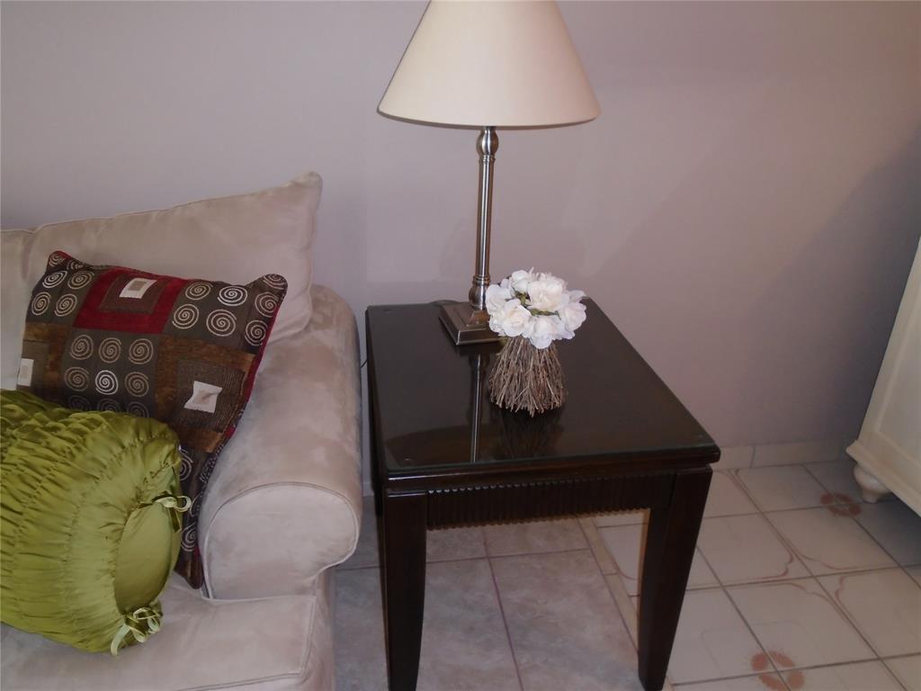 3165 Northeast 48th Court, Unit 110 Lighthouse Point, FL 33064 - Photo 8 of 49 a dining room with furniture and a chandelier