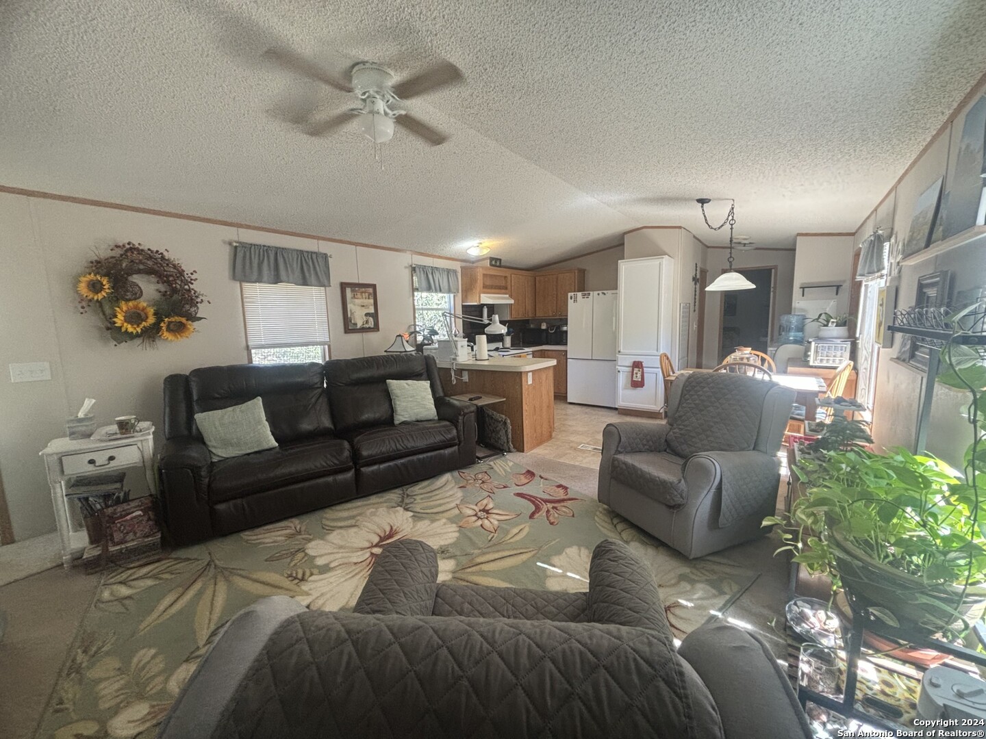 7971 Pronghorn Drive Spring Branch, TX 78070 - Photo 12 of 53 a living room with furniture and a chandelier