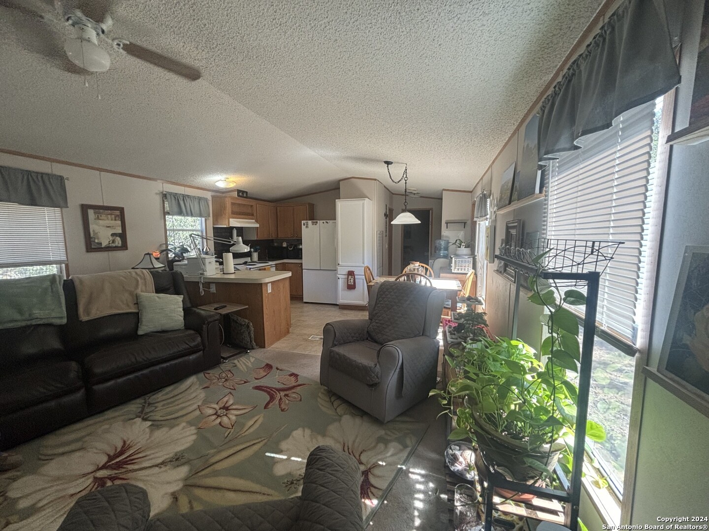 7971 Pronghorn Drive Spring Branch, TX 78070 - Photo 13 of 53 a living room with furniture and a fireplace