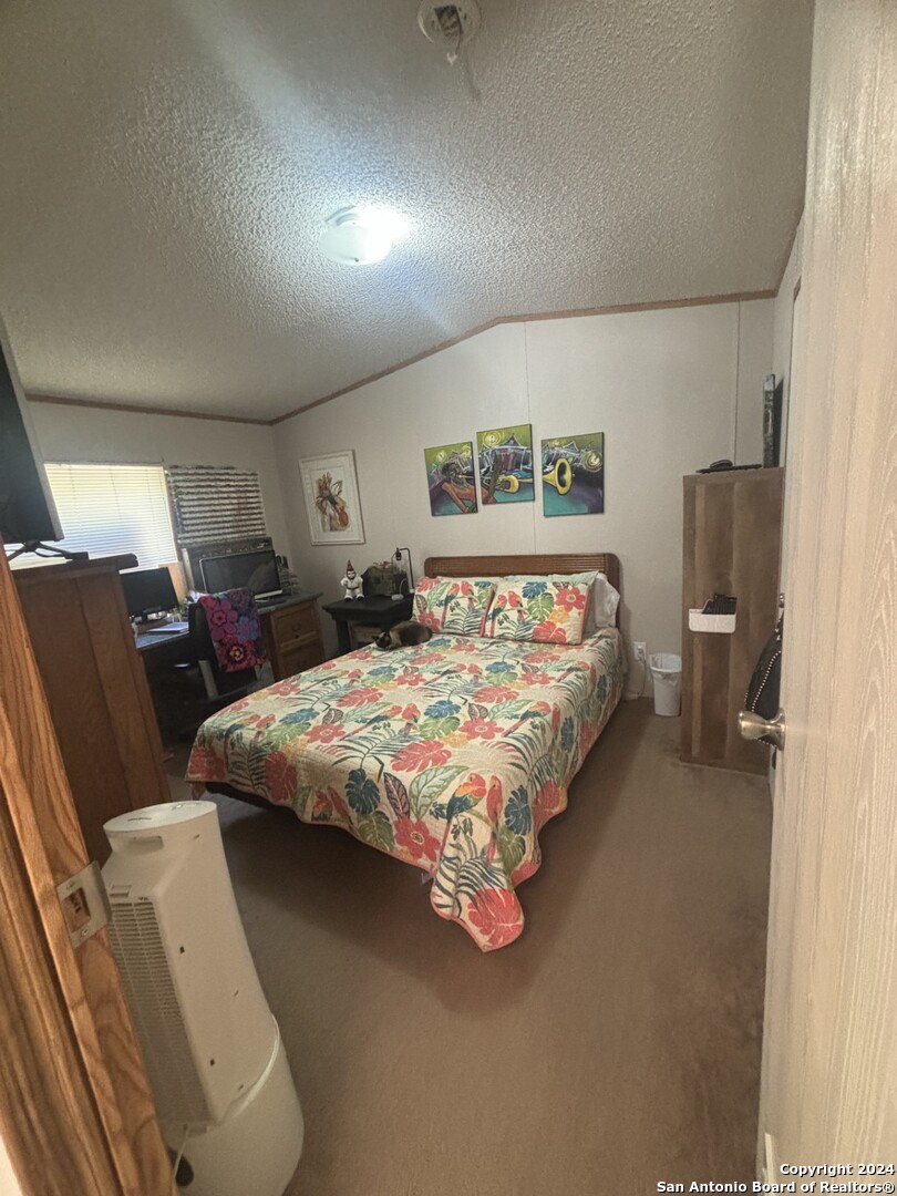 7971 Pronghorn Drive Spring Branch, TX 78070 - Photo 18 of 53 a bedroom with a bed and window