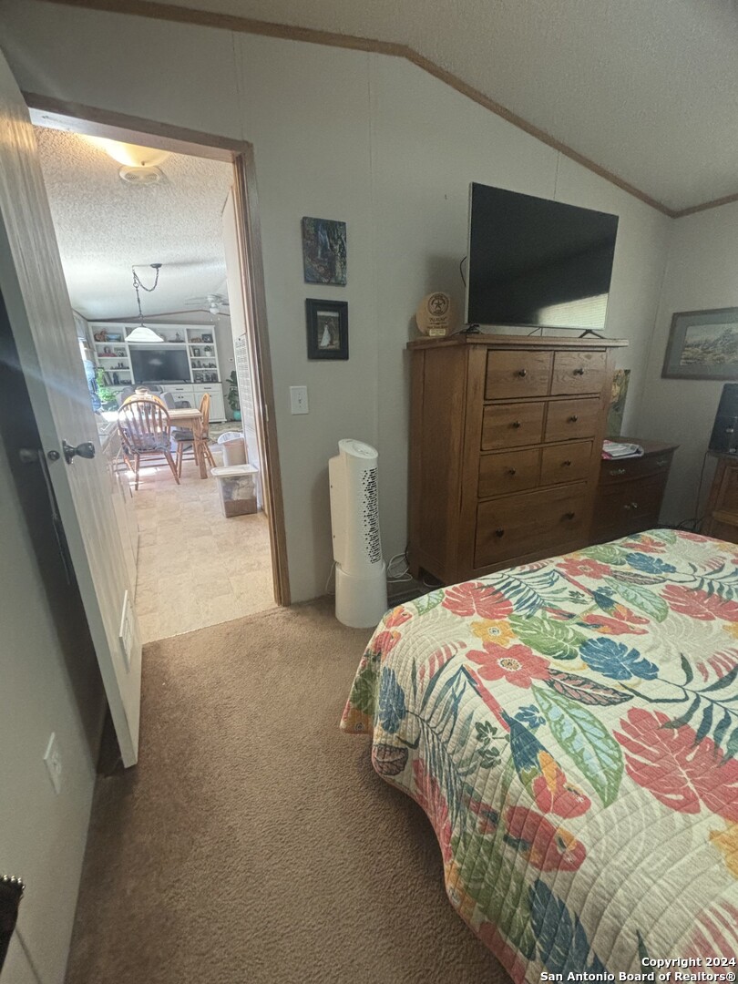 7971 Pronghorn Drive Spring Branch, TX 78070 - Photo 20 of 53 a bedroom with a bed and a flat screen tv