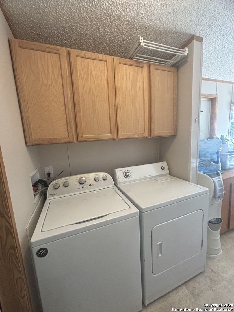 7971 Pronghorn Drive Spring Branch, TX 78070 - Photo 23 of 53 a utility room with dryer and washer