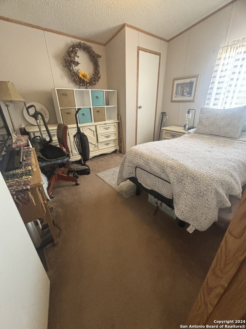 7971 Pronghorn Drive Spring Branch, TX 78070 - Photo 24 of 53 a bedroom with a bed and a window