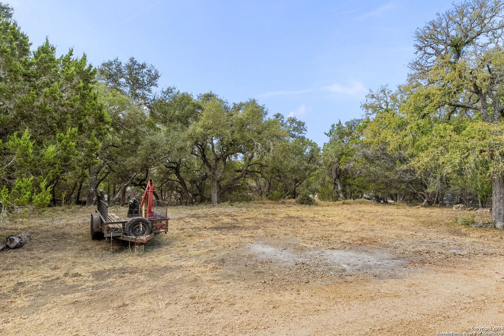 7971 Pronghorn Drive Spring Branch, TX 78070 - Photo 34 of 53 a backyard of a house with table and chairs