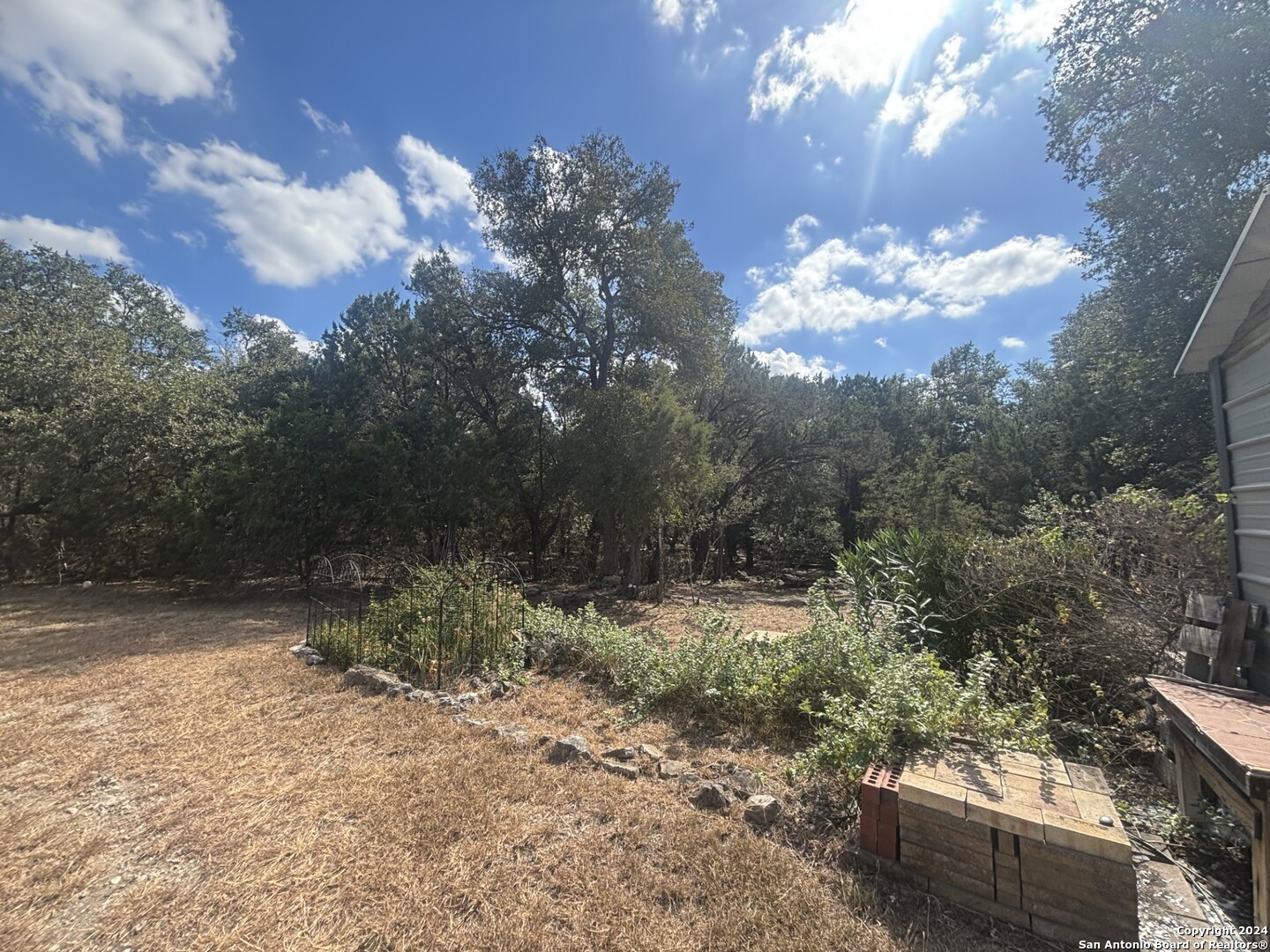 7971 Pronghorn Drive Spring Branch, TX 78070 - Photo 37 of 53 a view of a yard with lots of green space and mountain view