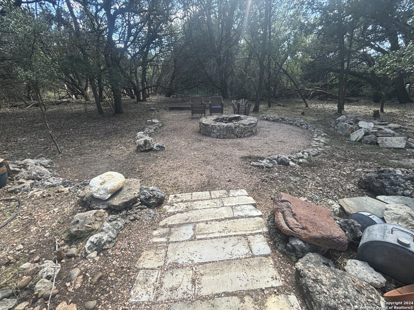 7971 Pronghorn Drive Spring Branch, TX 78070 - Photo 38 of 53 a backyard of a house with barbeque oven and outdoor seating