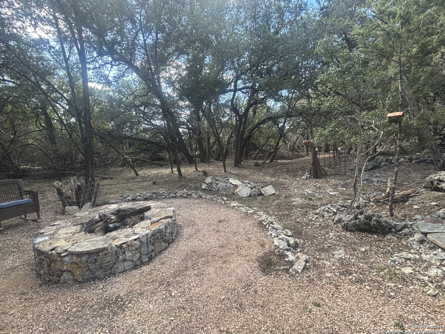 7971 Pronghorn Drive Spring Branch, TX 78070 - Photo 41 of 53 a view of a fire pit with large trees