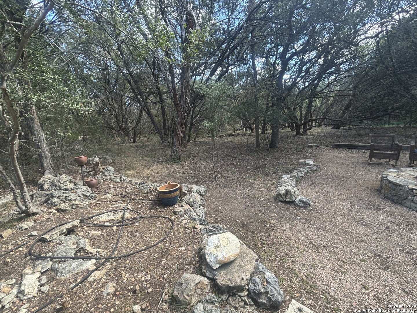 7971 Pronghorn Drive Spring Branch, TX 78070 - Photo 42 of 53 a backyard of a house with table and chairs
