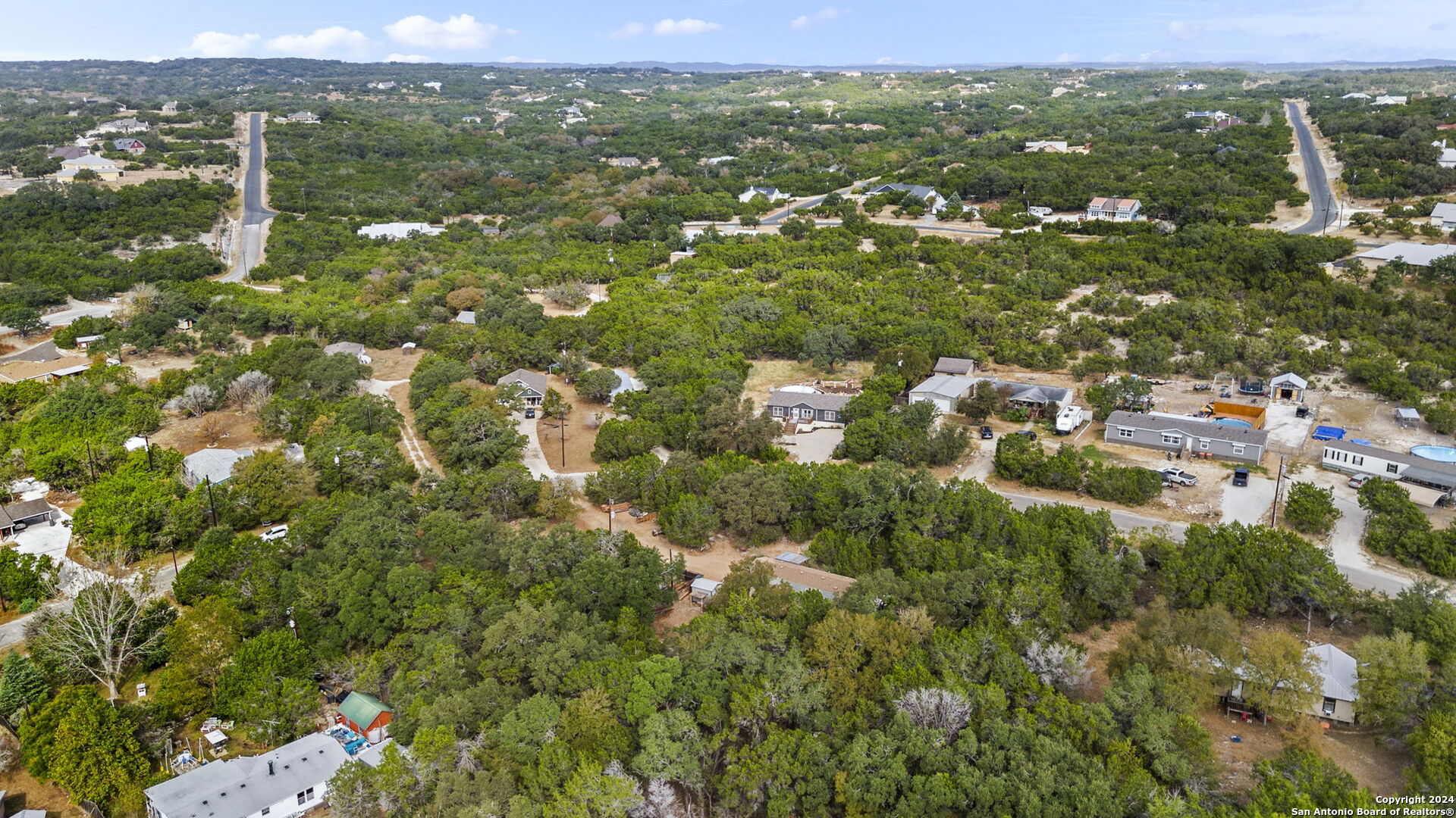 7971 Pronghorn Drive Spring Branch, TX 78070 - Photo 43 of 53 an aerial view of residential houses with outdoor space and trees
