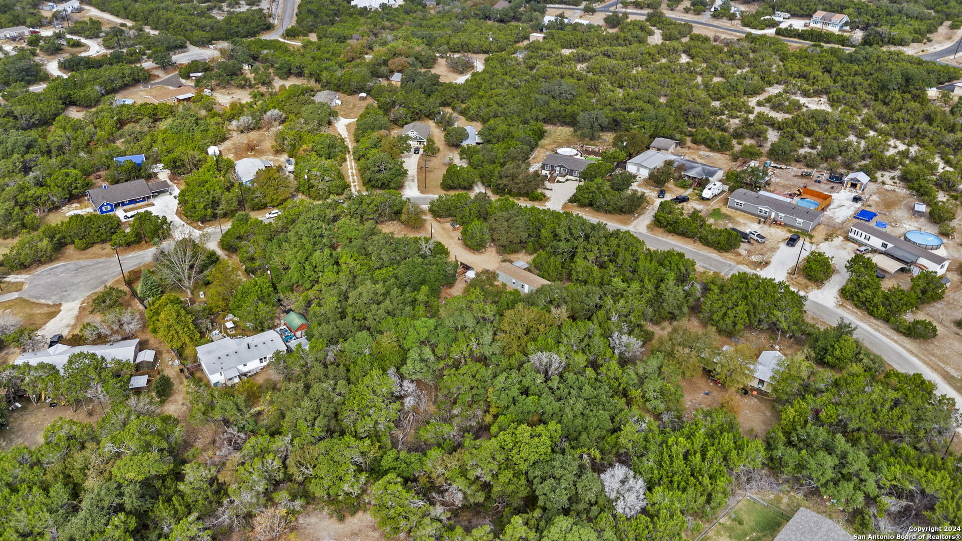 7971 Pronghorn Drive Spring Branch, TX 78070 - Photo 44 of 53 an aerial view of residential houses with open trees