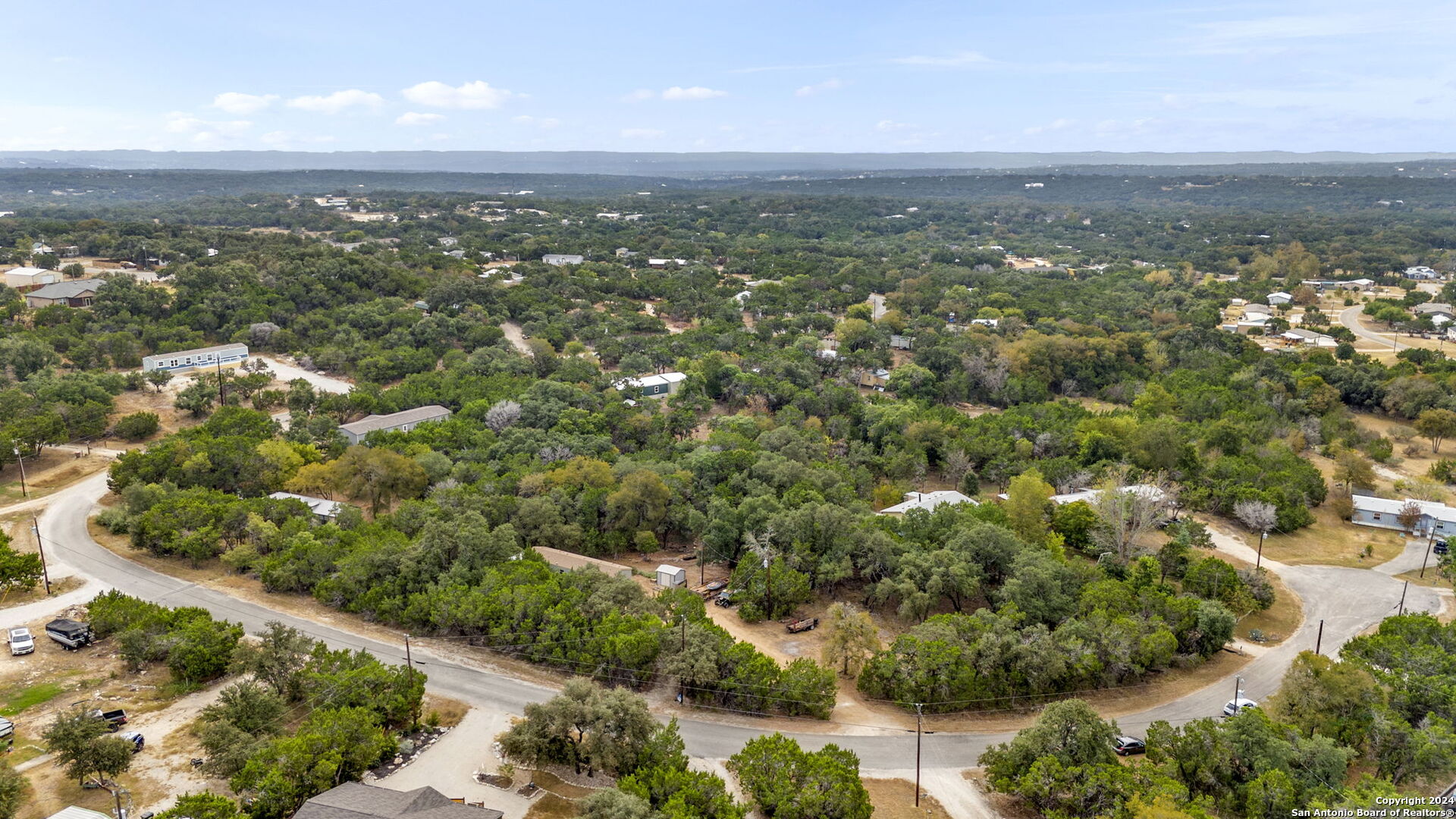 7971 Pronghorn Drive Spring Branch, TX 78070 - Photo 46 of 53 an aerial view of residential houses with outdoor space and trees