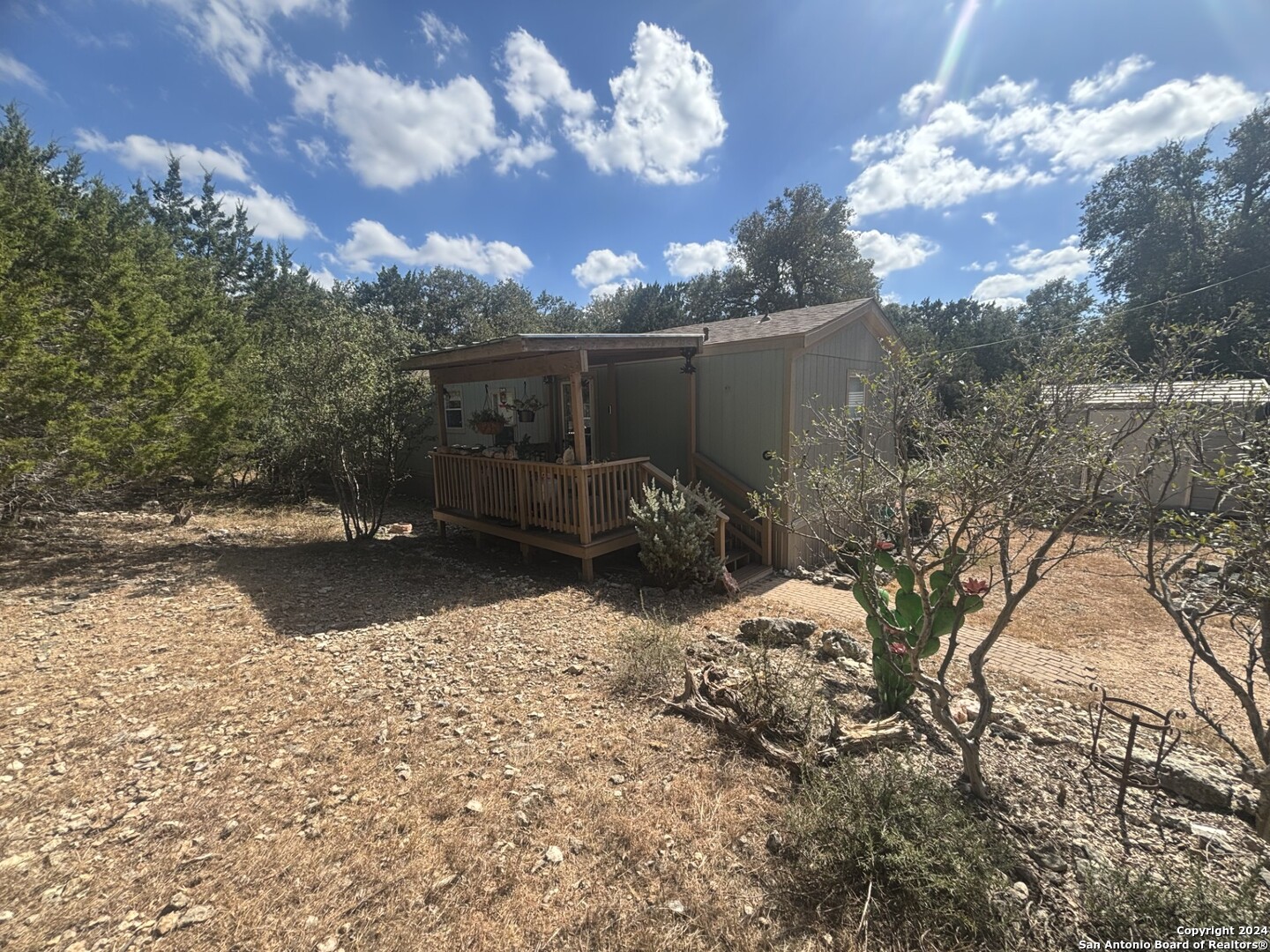 7971 Pronghorn Drive Spring Branch, TX 78070 - Photo 7 of 53 a backyard of a house with table and chairs