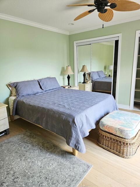 1420 Ocean Way, Unit 23C Jupiter, FL 33477 - Photo 11 of 32 a bedroom with a bed and window