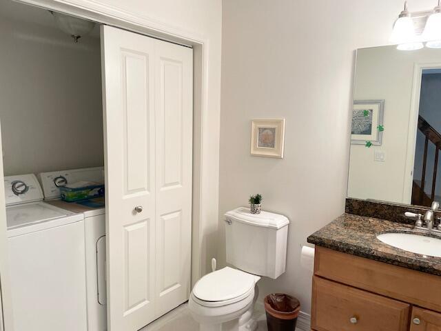 1420 Ocean Way, Unit 23C Jupiter, FL 33477 - Photo 14 of 32 a bathroom with a granite countertop sink toilet and shower