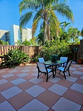 a view of a chairs and table on the patio