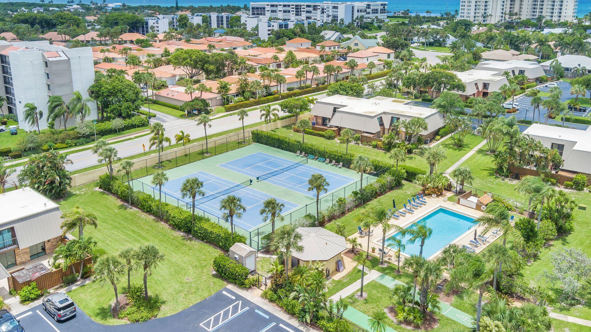1420 Ocean Way, Unit 23C Jupiter, FL 33477 - Photo 21 of 32 an aerial view of residential houses with outdoor space