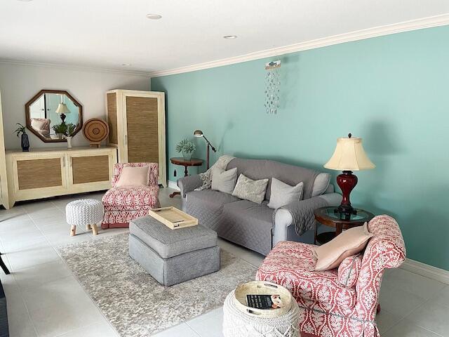 1420 Ocean Way, Unit 23C Jupiter, FL 33477 - Photo 3 of 32 a living room with furniture and painting on the wall