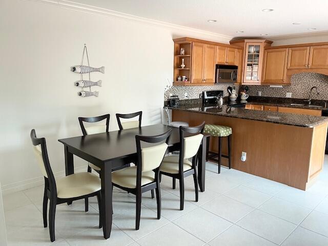 1420 Ocean Way, Unit 23C Jupiter, FL 33477 - Photo 5 of 32 a view of a dining room with furniture