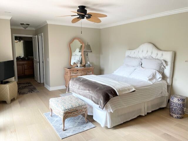 1420 Ocean Way, Unit 23C Jupiter, FL 33477 - Photo 8 of 32 a bedroom with a bed and a chandelier