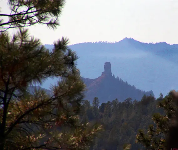 a view of a house with a mountain and a mountain in the background