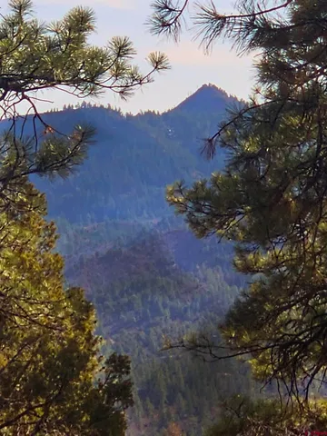 a view of a street with a mountain in the background