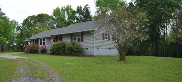 6298 Thomaston Road Macon, GA 31220 - Photo 2 of 33 a view of a house with backyard and garden