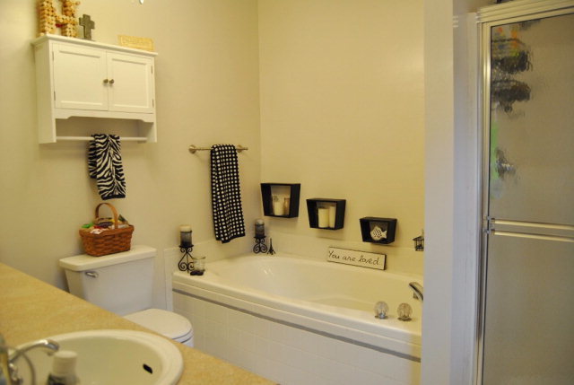 6298 Thomaston Road Macon, GA 31220 - Photo 14 of 33 a bathroom with a sink a toilet and shower