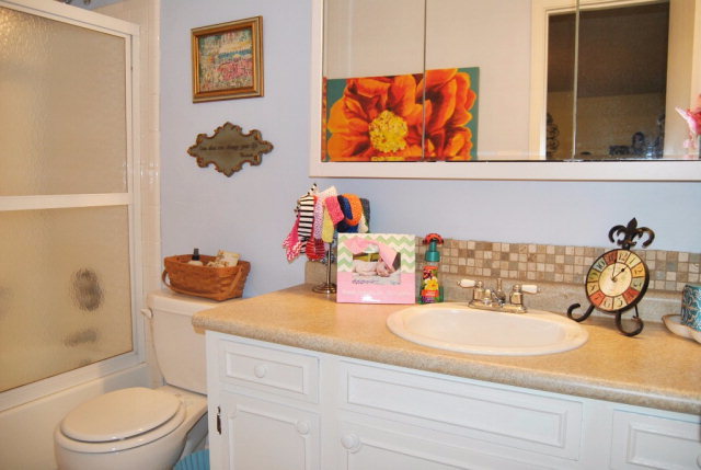6298 Thomaston Road Macon, GA 31220 - Photo 19 of 33 a bathroom with a toilet sink and mirror