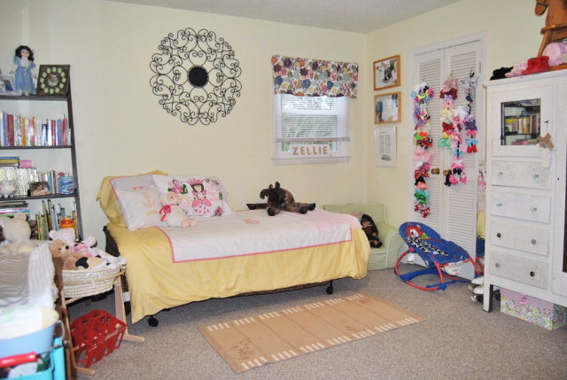6298 Thomaston Road Macon, GA 31220 - Photo 20 of 33 a bedroom with a bed and book shelf
