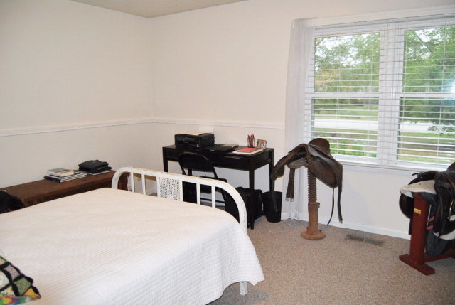 6298 Thomaston Road Macon, GA 31220 - Photo 22 of 33 a bedroom with a bed and a table