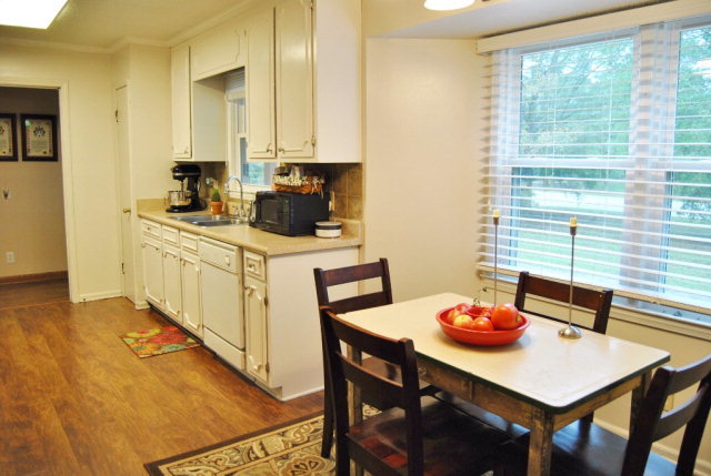6298 Thomaston Road Macon, GA 31220 - Photo 25 of 33 a kitchen with stainless steel appliances a table chairs and a refrigerator