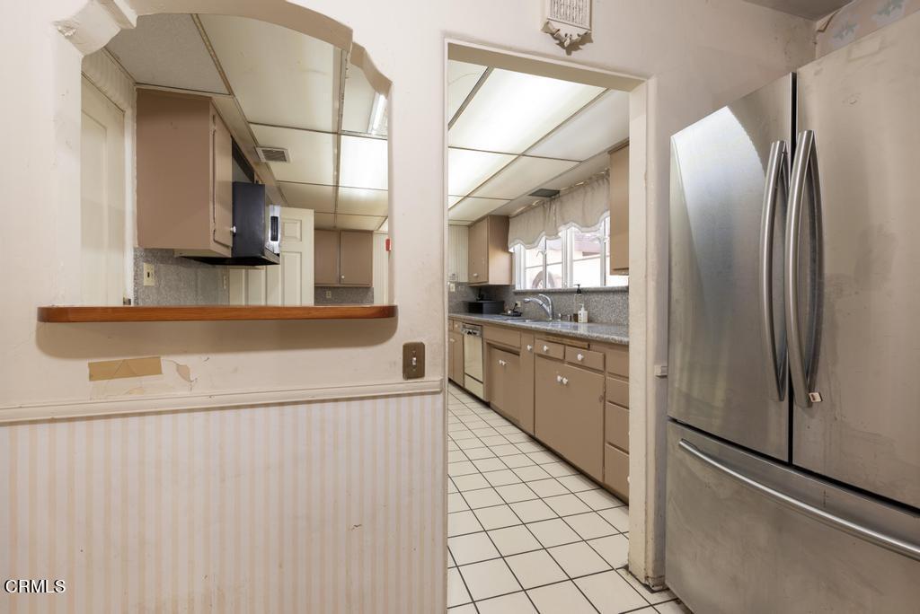 893 Gainsborough Drive Pasadena, CA 91107 - Photo 17 of 62 a kitchen with stainless steel appliances a refrigerator and a stove top oven