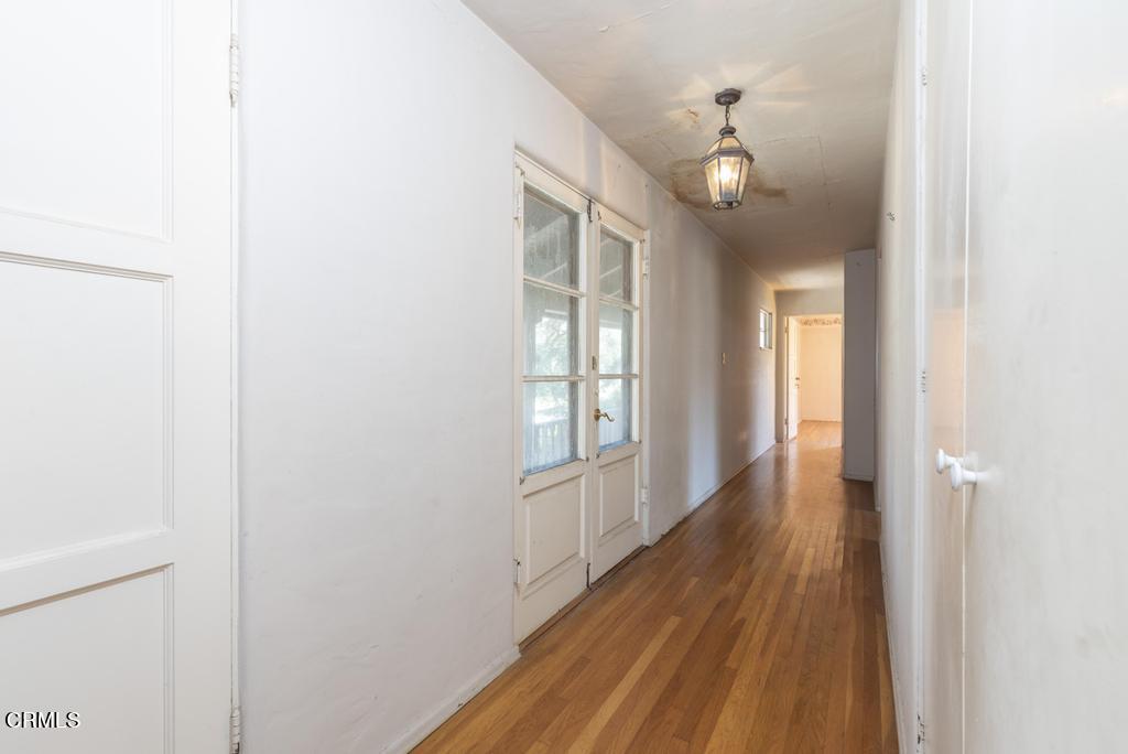 893 Gainsborough Drive Pasadena, CA 91107 - Photo 24 of 62 a view of an empty room with wooden floor and a window