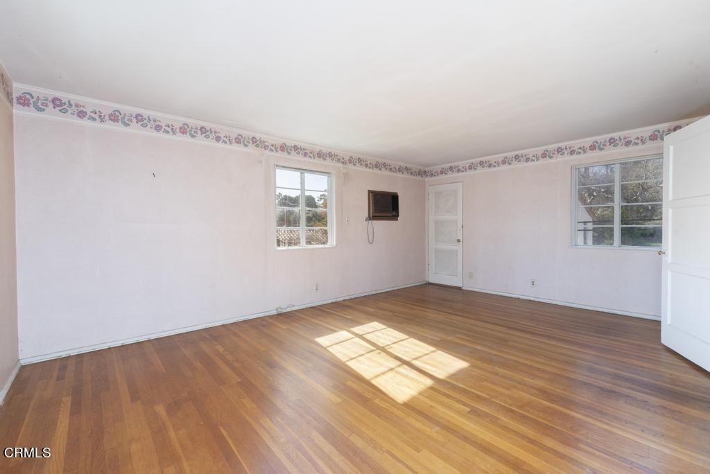 893 Gainsborough Drive Pasadena, CA 91107 - Photo 27 of 62 a view of empty room with wooden floor and fan