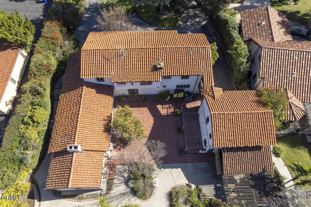 893 Gainsborough Drive Pasadena, CA 91107 - Photo 53 of 62 a view of a brick house with plants and wooden floor
