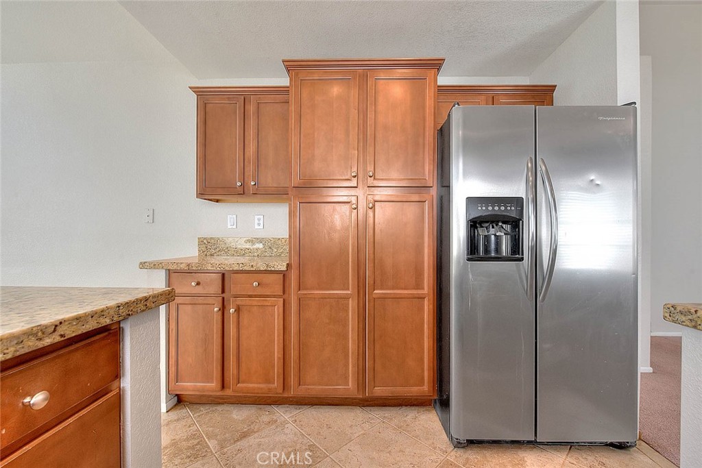 39220 Cala Del Valle Murrieta, CA 92562 - Photo 13 of 47 a kitchen with stainless steel appliances granite countertop a refrigerator and a sink