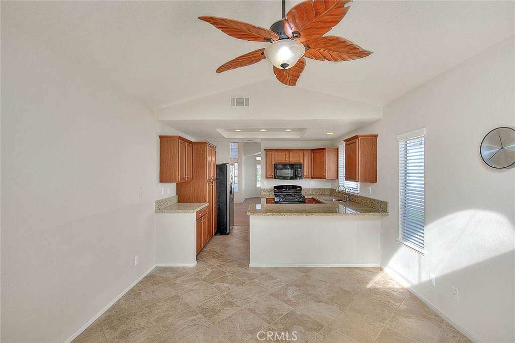 39220 Cala Del Valle Murrieta, CA 92562 - Photo 18 of 47 a view of living room with furniture and a ceiling fan