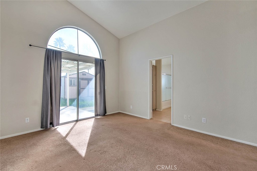 39220 Cala Del Valle Murrieta, CA 92562 - Photo 22 of 47 an empty room with large windows and a mirror