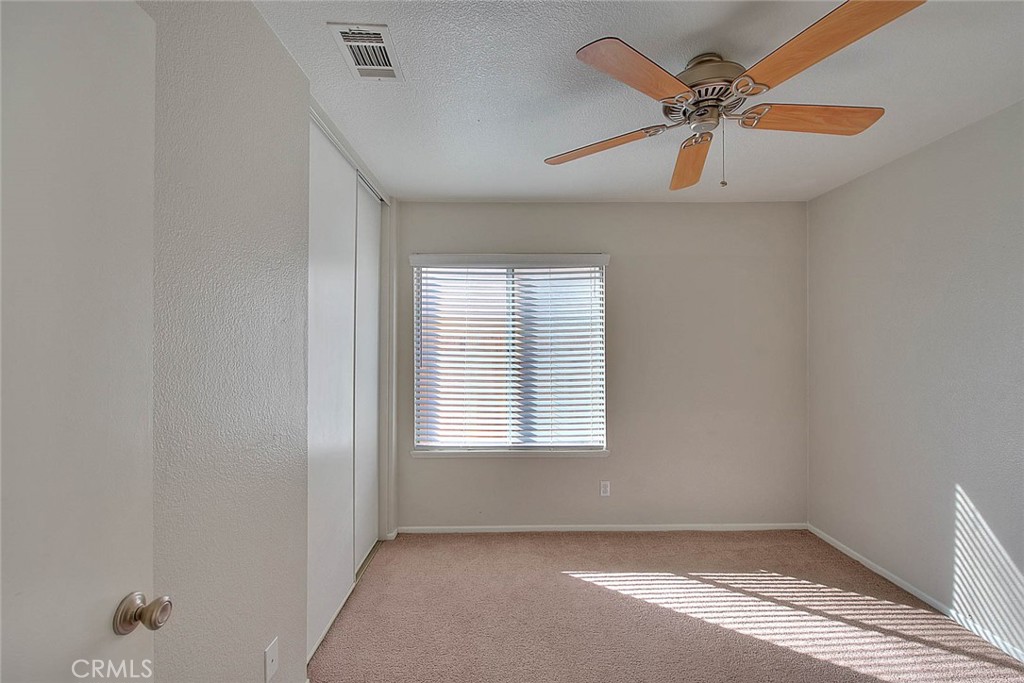 39220 Cala Del Valle Murrieta, CA 92562 - Photo 27 of 47 an empty room with windows and fan