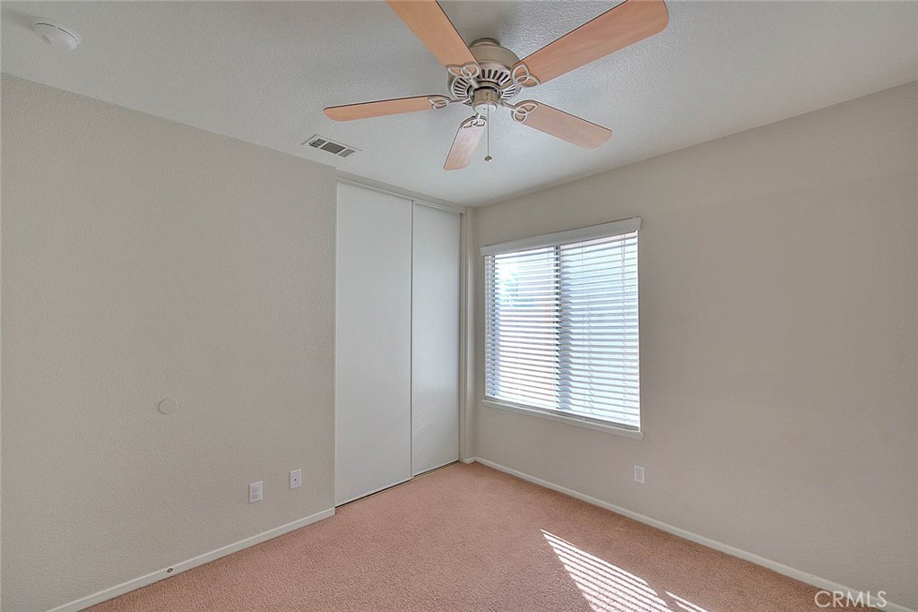39220 Cala Del Valle Murrieta, CA 92562 - Photo 28 of 47 an empty room with windows and fan