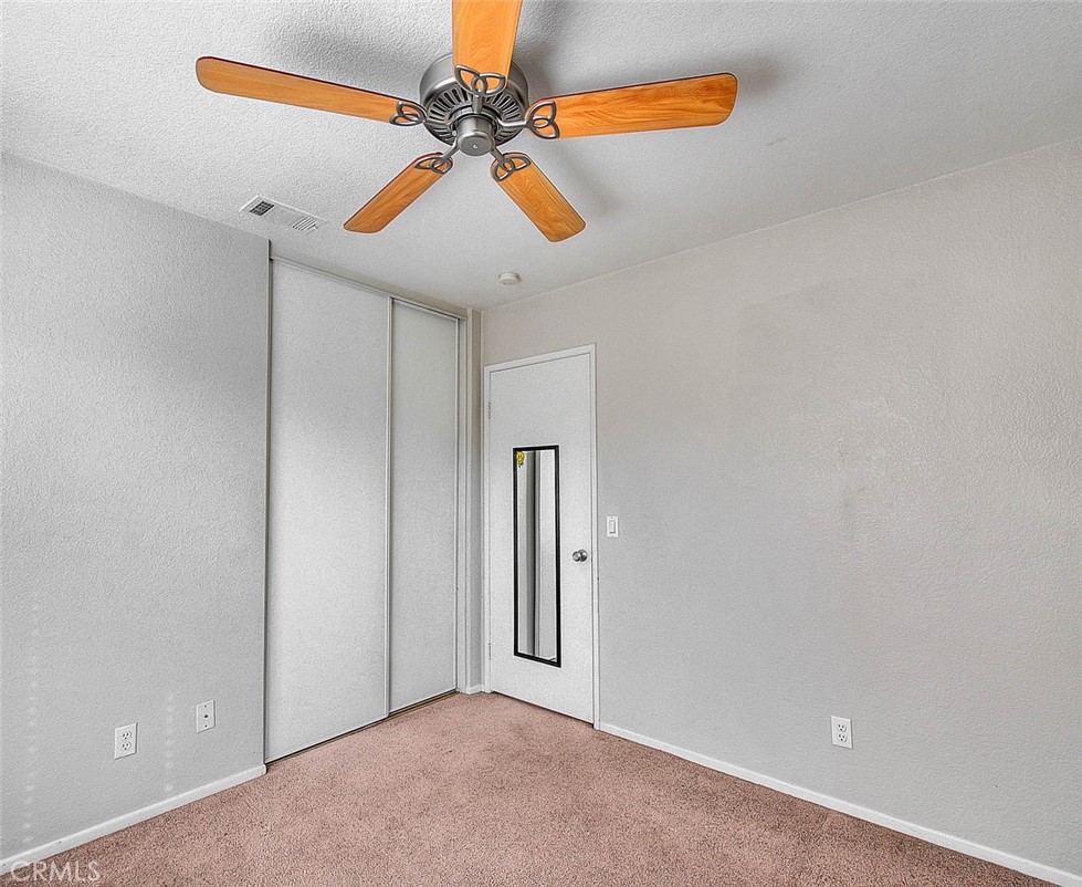 39220 Cala Del Valle Murrieta, CA 92562 - Photo 30 of 47 an empty room with windows and fan