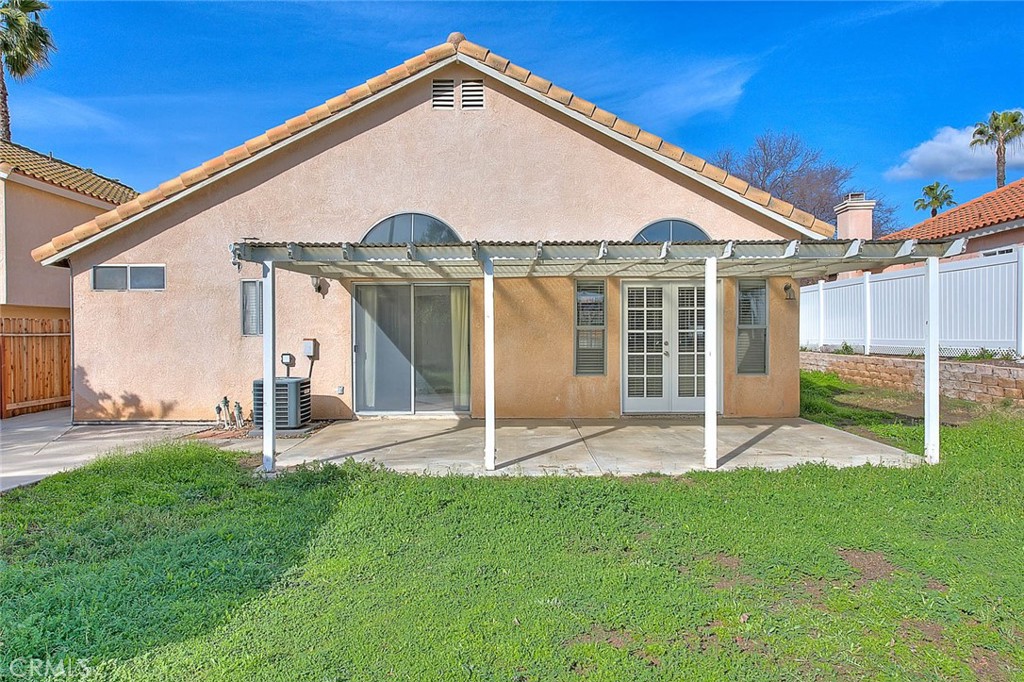 39220 Cala Del Valle Murrieta, CA 92562 - Photo 32 of 47 a view of a house with a yard and fence