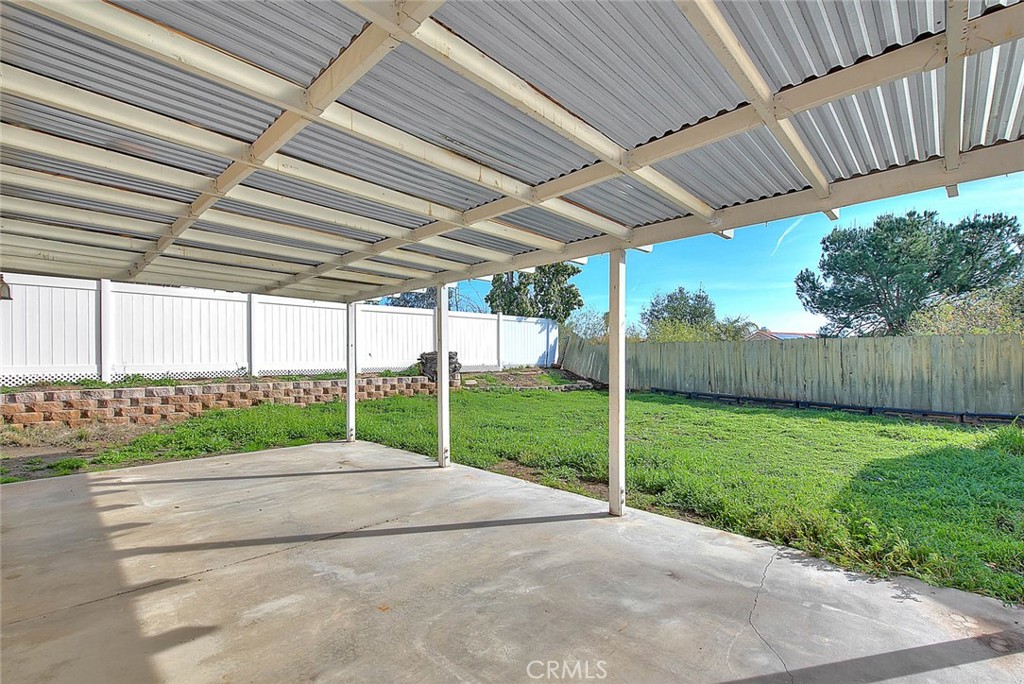 39220 Cala Del Valle Murrieta, CA 92562 - Photo 36 of 47 a view of a backyard with wooden fence
