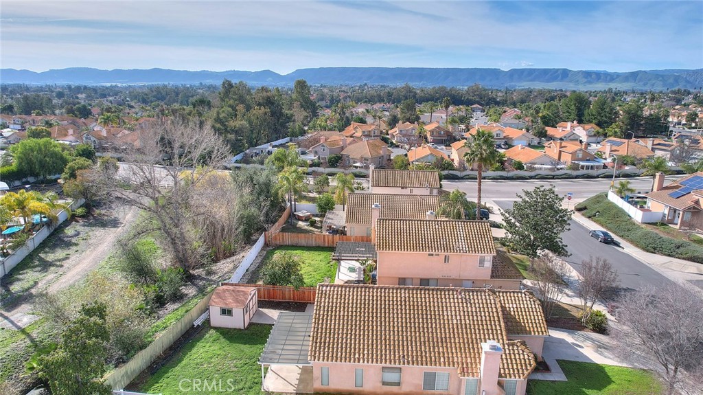 39220 Cala Del Valle Murrieta, CA 92562 - Photo 43 of 47 an aerial view of a house with lots of trees