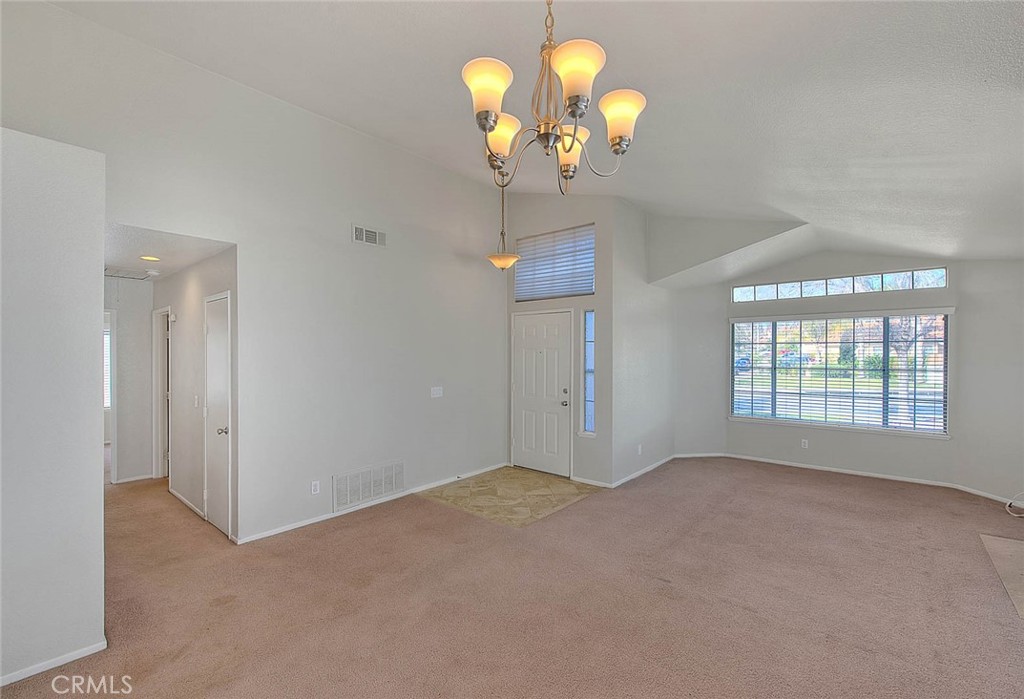 39220 Cala Del Valle Murrieta, CA 92562 - Photo 6 of 47 a view of an empty room with a window