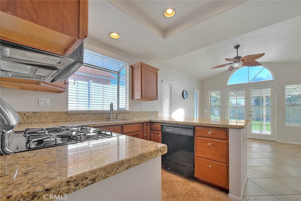 39220 Cala Del Valle Murrieta, CA 92562 - Photo 9 of 47 a large kitchen with a stove and a sink