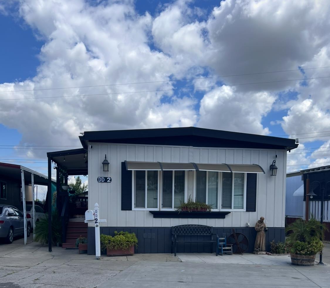 4143 Yosemite, Unit DD2 Modesto, CA 95357 - Photo 1 of 1 a front view of a house with garden